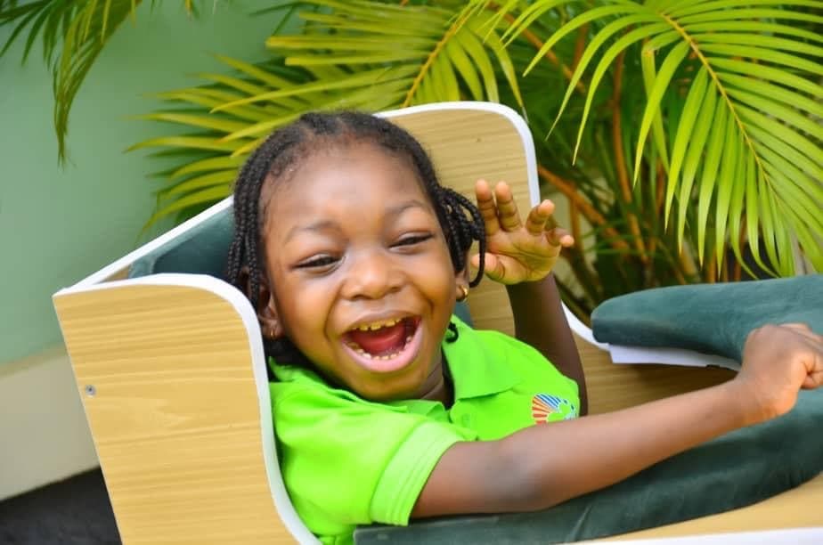 A child at SECHILD's center laughing joyfully